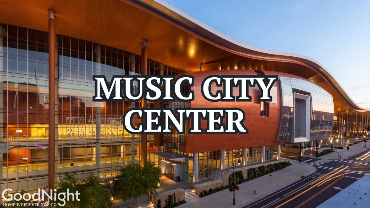 This image features the iconic Music City Center building with its distinctive curved roof, expansive glass façade, and surrounding greenery. The lively atmosphere is evident, suggesting ongoing events and business gatherings in a vibrant downtown setting.